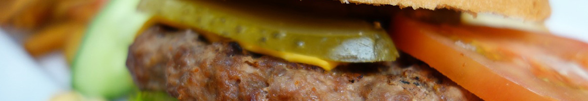 Eating Barbeque Burger Greek at Gus & Us Grill restaurant in Allen Park, MI.